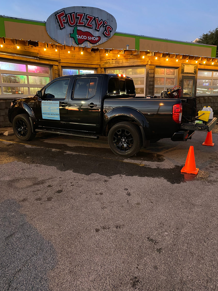 Abilene Exterior Cleaning service truck and equipment outside a restaurant